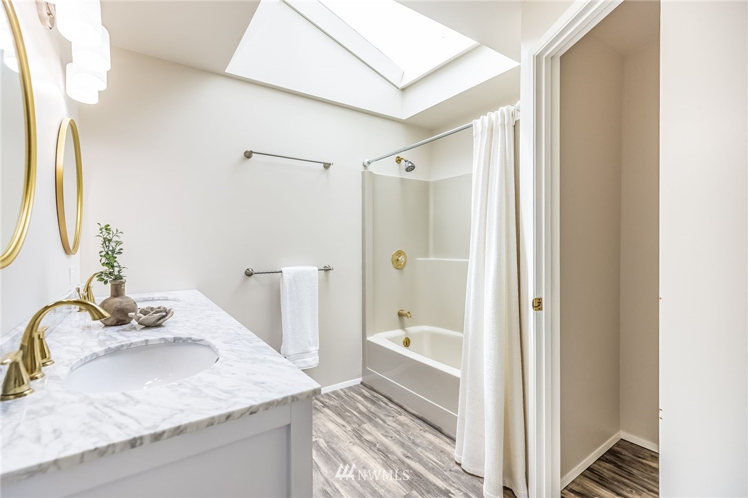 16204 Southeast 132nd Street Renton, WA 98059 - Photo 13 of 38 a bathroom with a granite countertop sink and a mirror