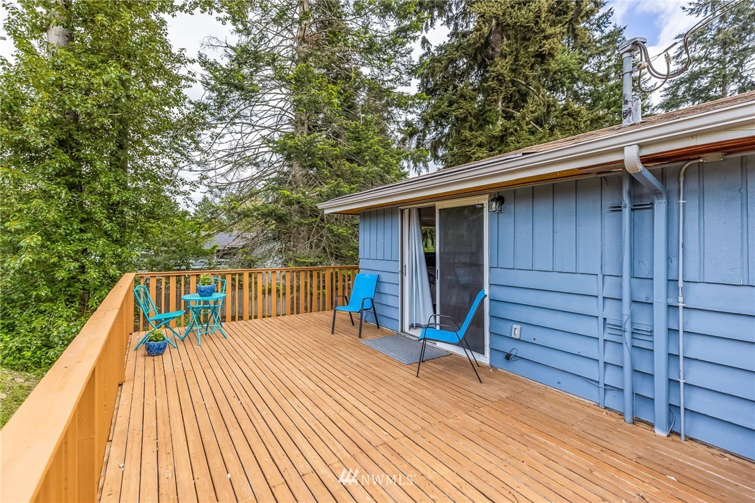 16204 Southeast 132nd Street Renton, WA 98059 - Photo 16 of 38 a view of backyard with a deck and wooden floor