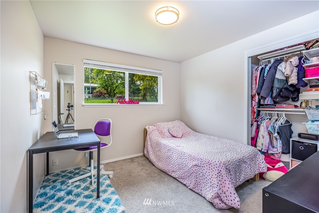 16204 Southeast 132nd Street Renton, WA 98059 - Photo 18 of 38 a bedroom with a bed and a window