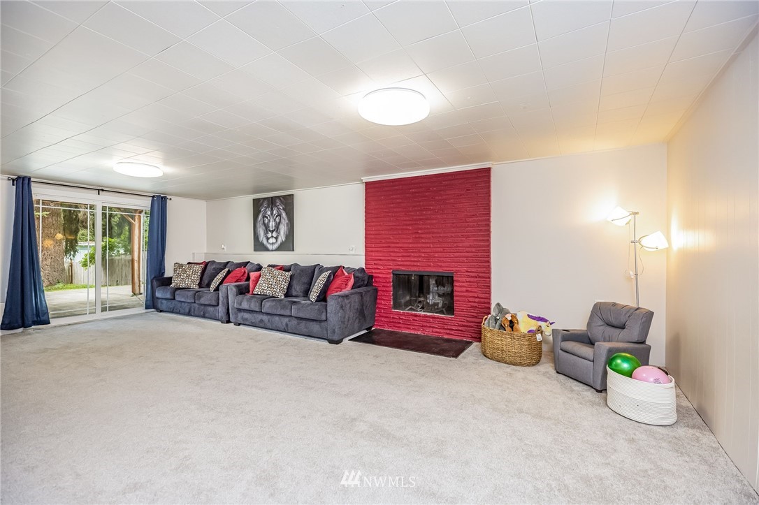 16204 Southeast 132nd Street Renton, WA 98059 - Photo 20 of 38 a bedroom with furniture and a bed