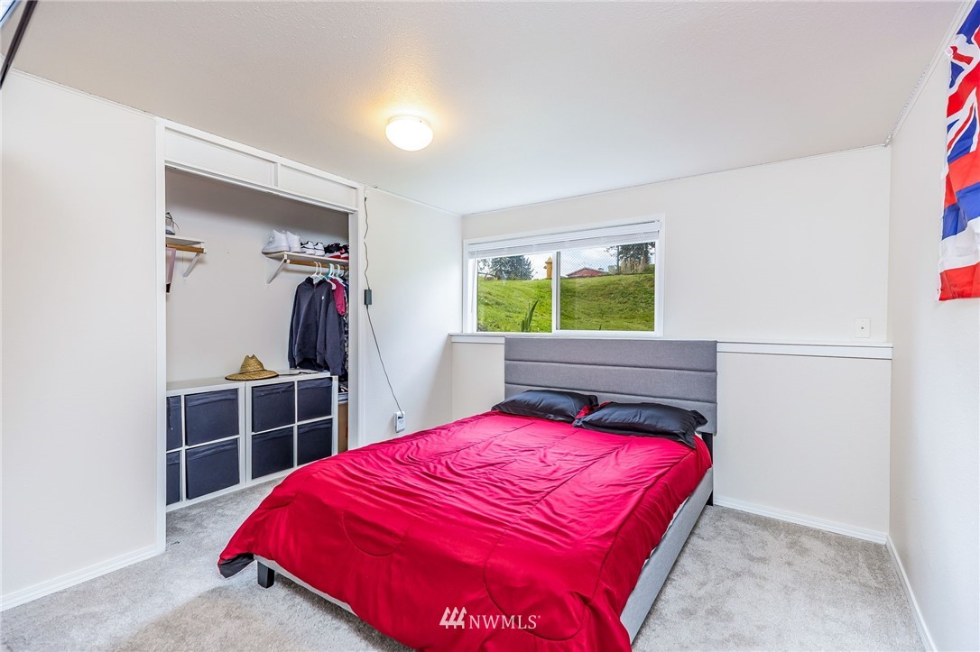 16204 Southeast 132nd Street Renton, WA 98059 - Photo 23 of 38 a bedroom with a bed and a closet
