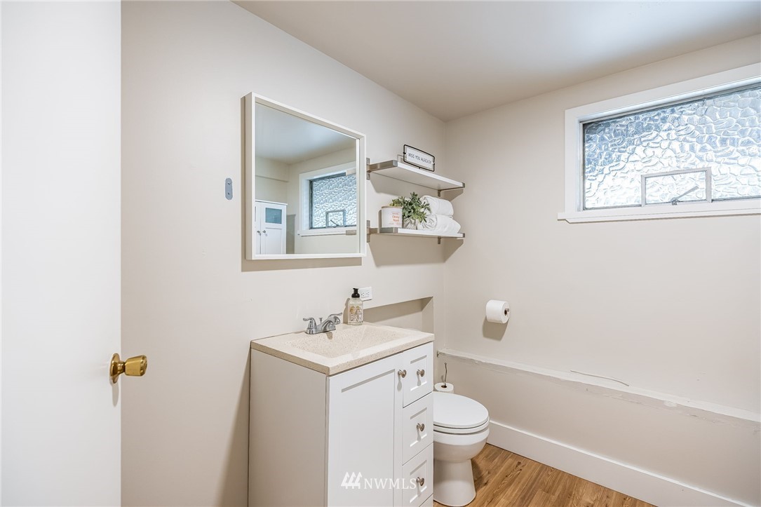 16204 Southeast 132nd Street Renton, WA 98059 - Photo 27 of 38 a bathroom with a toilet sink and mirror