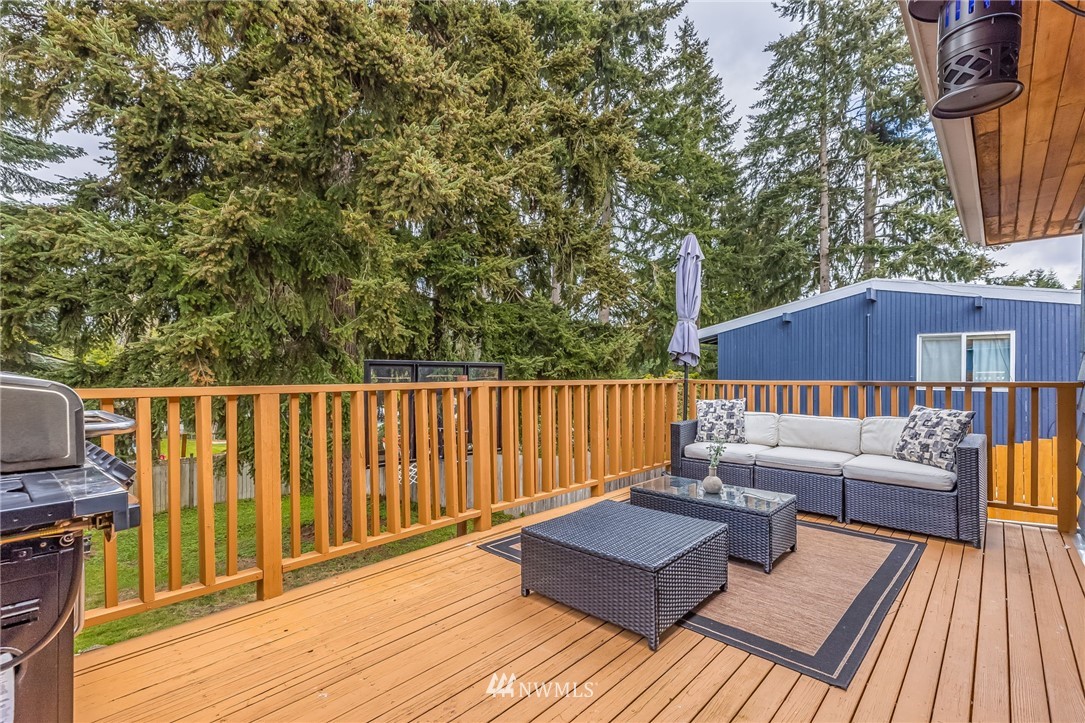 16204 Southeast 132nd Street Renton, WA 98059 - Photo 28 of 38 a balcony with wooden floor and outdoor seating