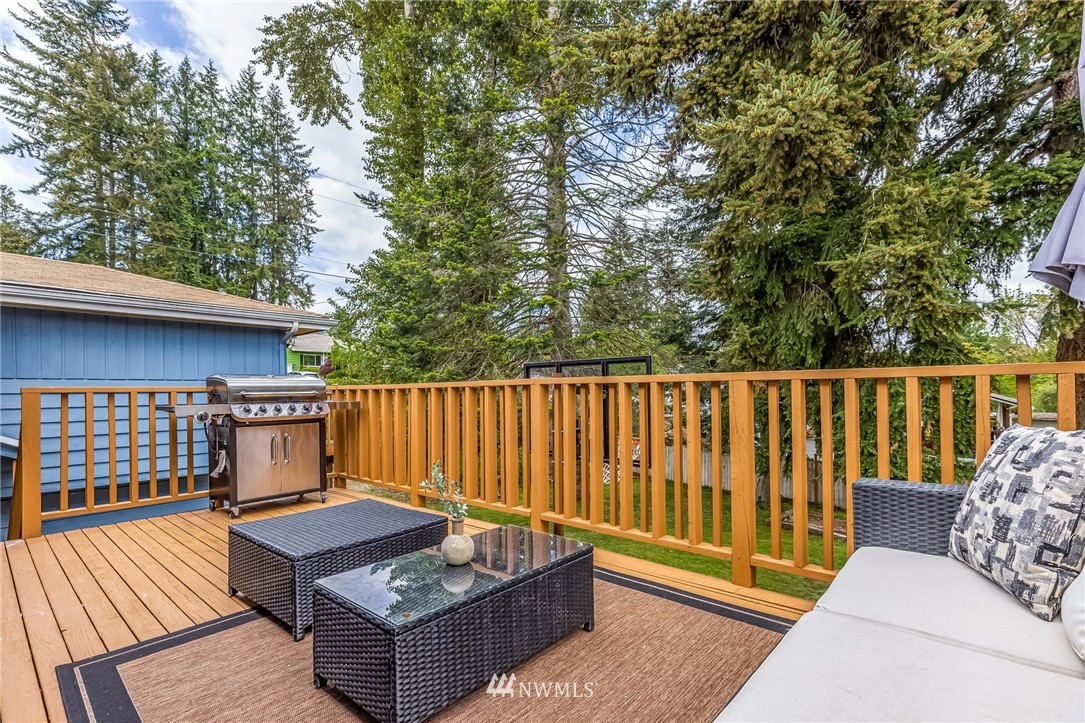 16204 Southeast 132nd Street Renton, WA 98059 - Photo 29 of 38 a view of balcony with wooden floor and outdoor seating