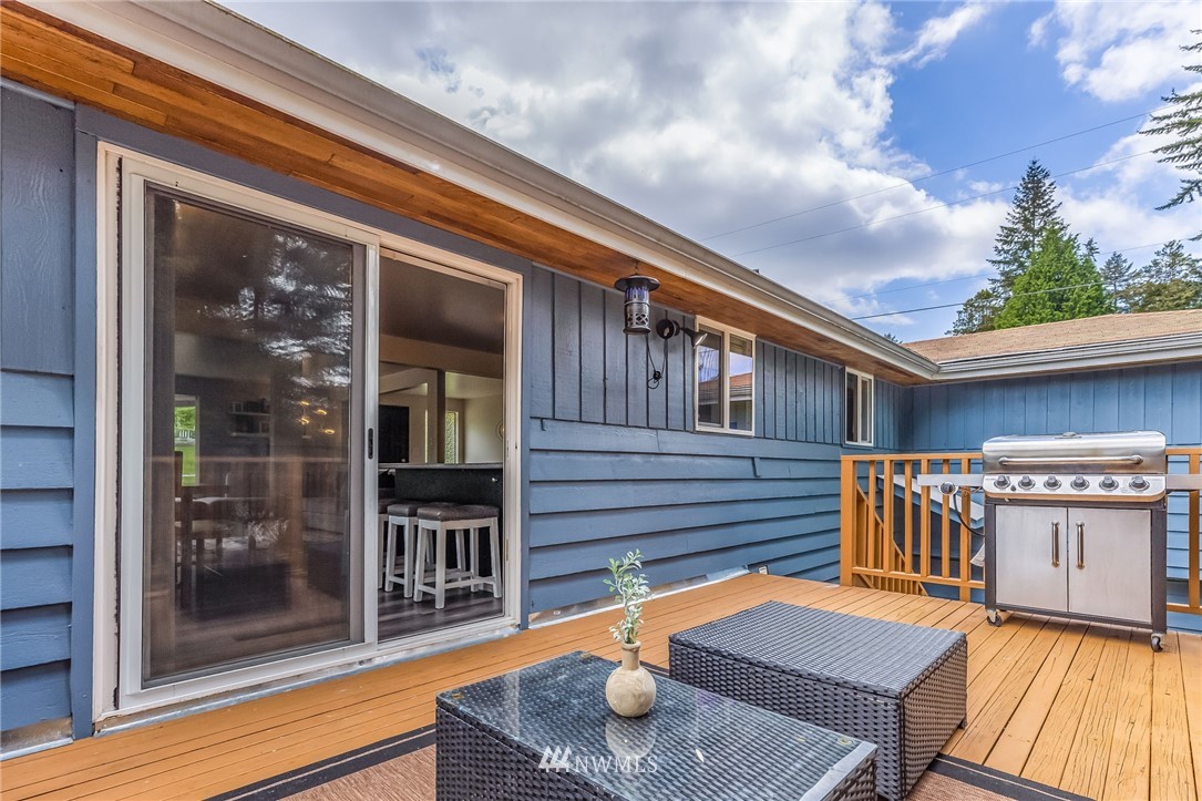 16204 Southeast 132nd Street Renton, WA 98059 - Photo 30 of 38 a balcony with furniture and wooden floor