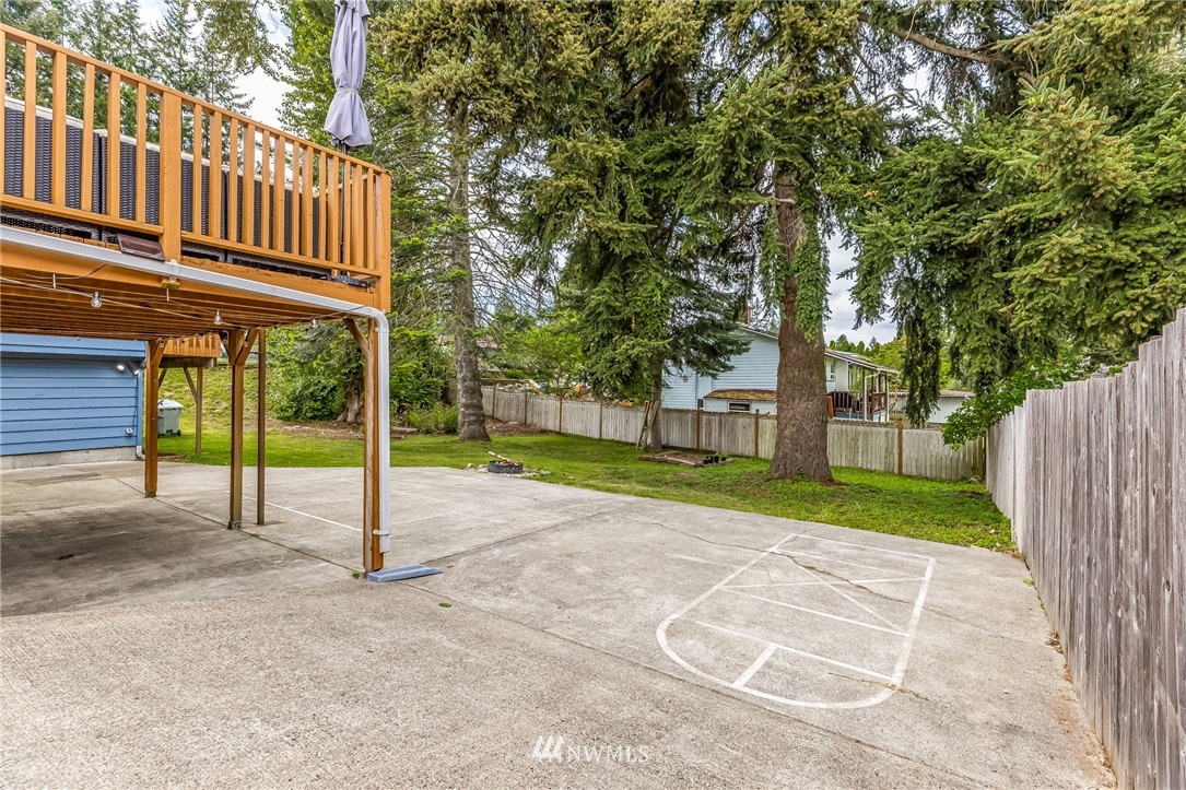 16204 Southeast 132nd Street Renton, WA 98059 - Photo 32 of 38 a view of a house with a backyard and tree