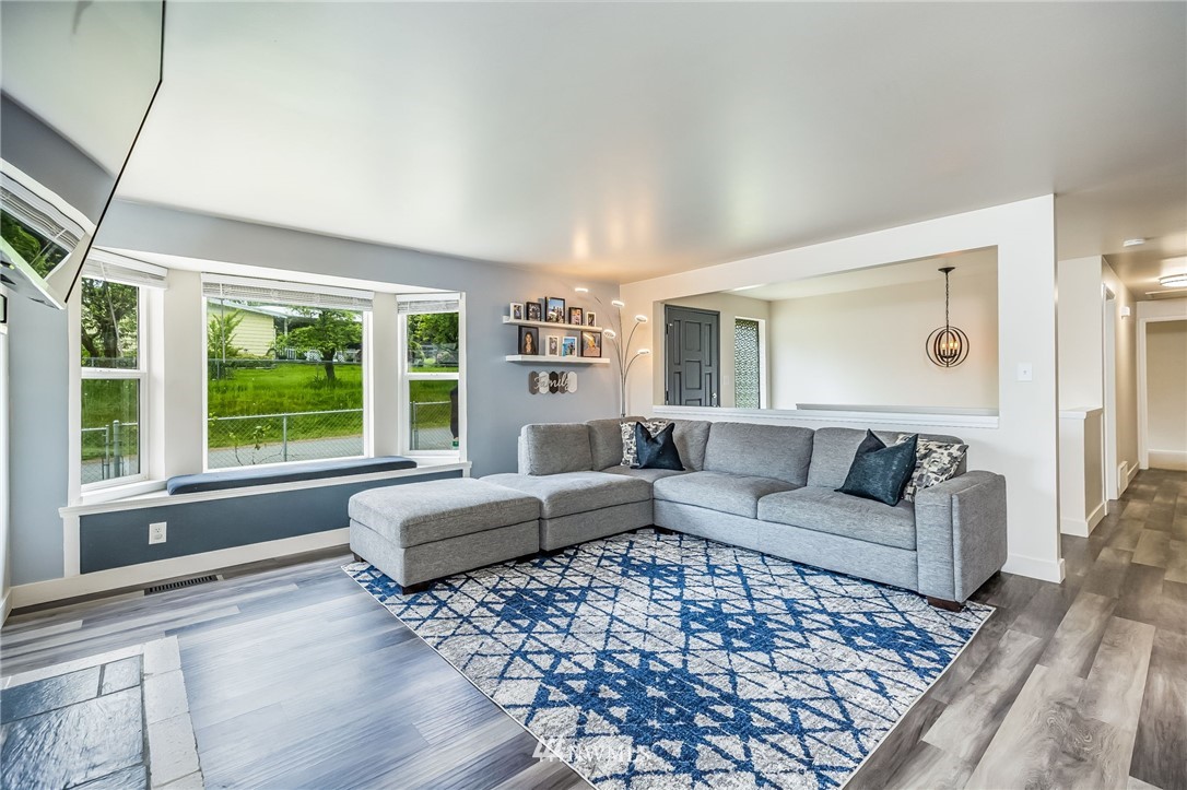 16204 Southeast 132nd Street Renton, WA 98059 - Photo 5 of 38 a living room with furniture and a large window