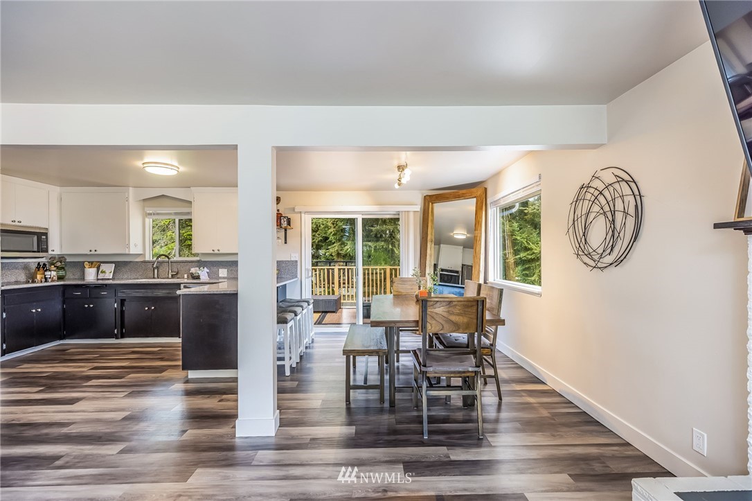 16204 Southeast 132nd Street Renton, WA 98059 - Photo 7 of 38 a view of a dining room with furniture window and wooden floor