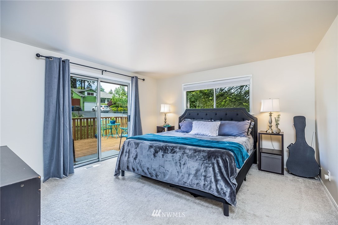 16204 Southeast 132nd Street Renton, WA 98059 - Photo 10 of 38 a bed room with a bed and a couch