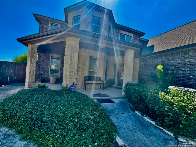 a view of a livingroom with wooden floor and furniture