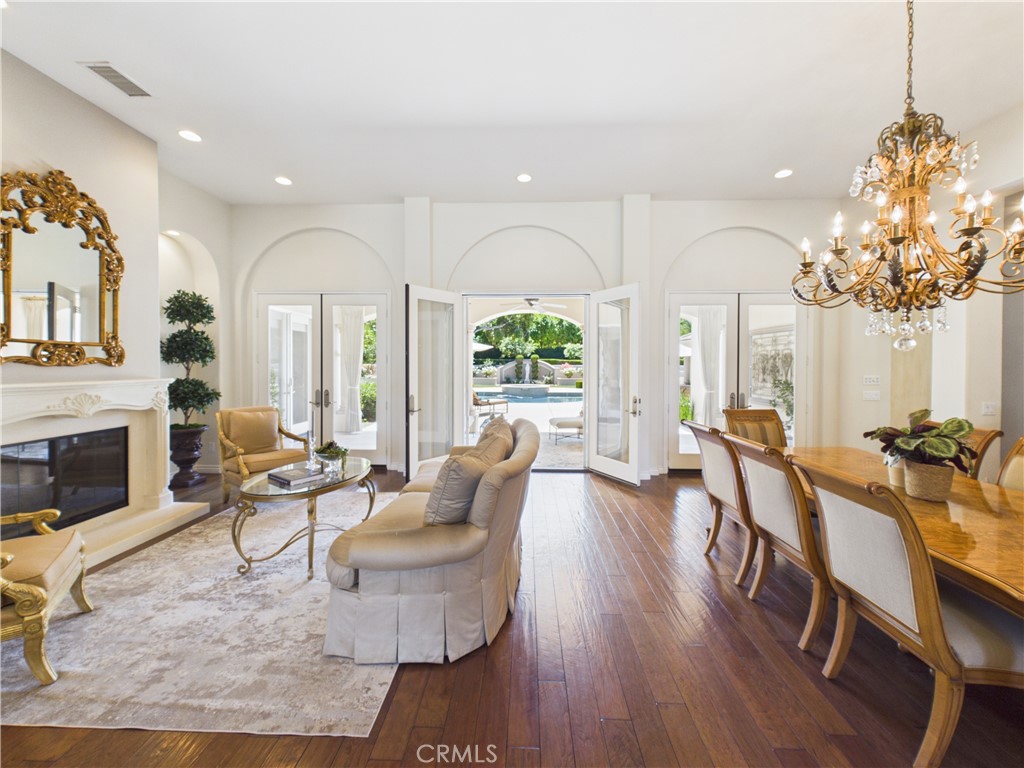 1662 Cherokee Road Corona, CA 92881 - Photo 11 of 60 a living room with fireplace furniture and a chandelier