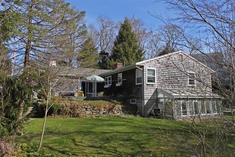 54 Route 149 Marstons Mills, MA 02648 - Photo 13 of 14 a front view of house with yard and green space