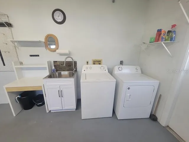 a view of a backyard with a wooden fence