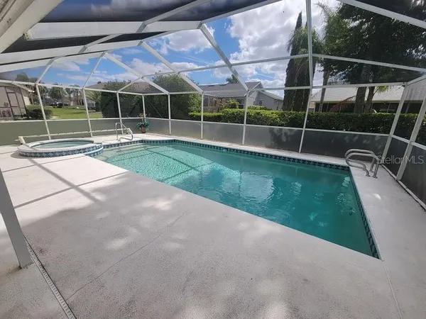 a view of a swimming pool with a patio