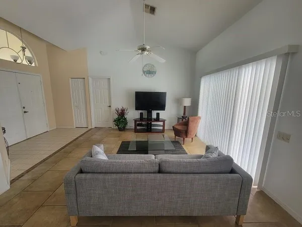 a living room with furniture and a large window