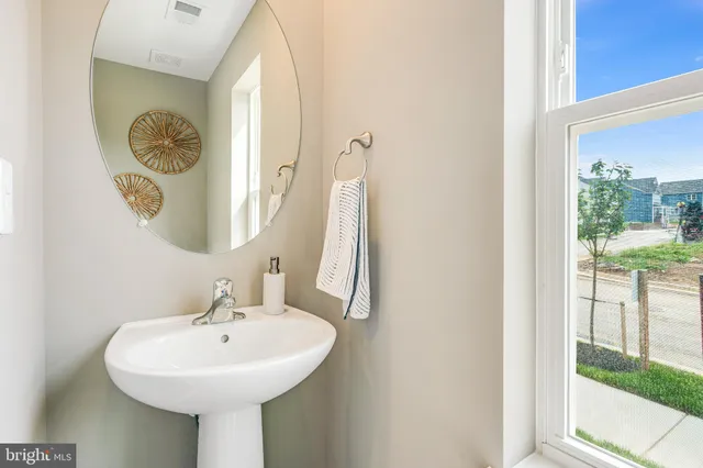 a bedroom with a bed dresser and a window