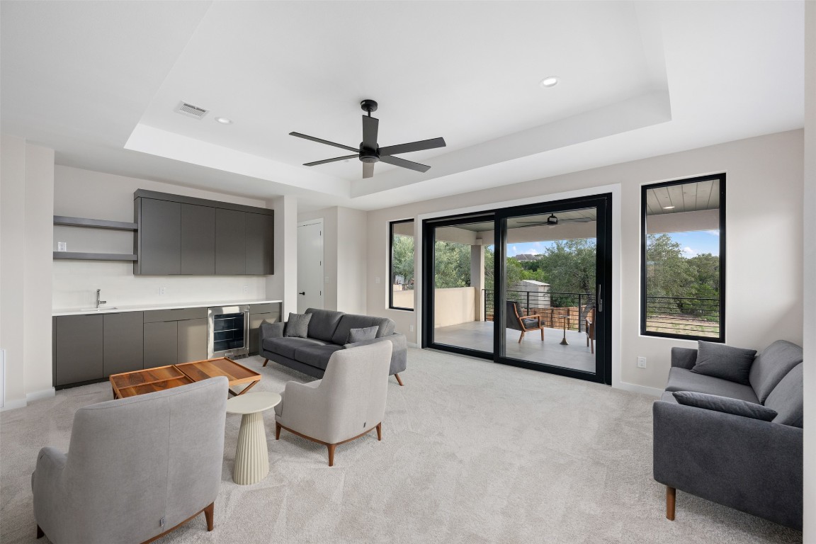 13701 A Montview Drive Austin, TX 78732 - Photo 19 of 40 Enjoy entertaining with wet bar, wine/drink refrigerator, and Rehau sliding doors to covered deck.