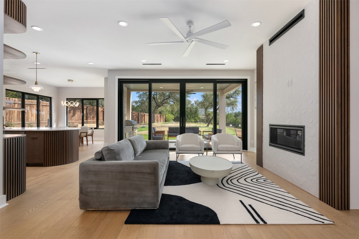 13701 A Montview Drive Austin, TX 78732 - Photo 3 of 40 Family room open to kitchen and dining with Rehau sliding doors to covered patio.