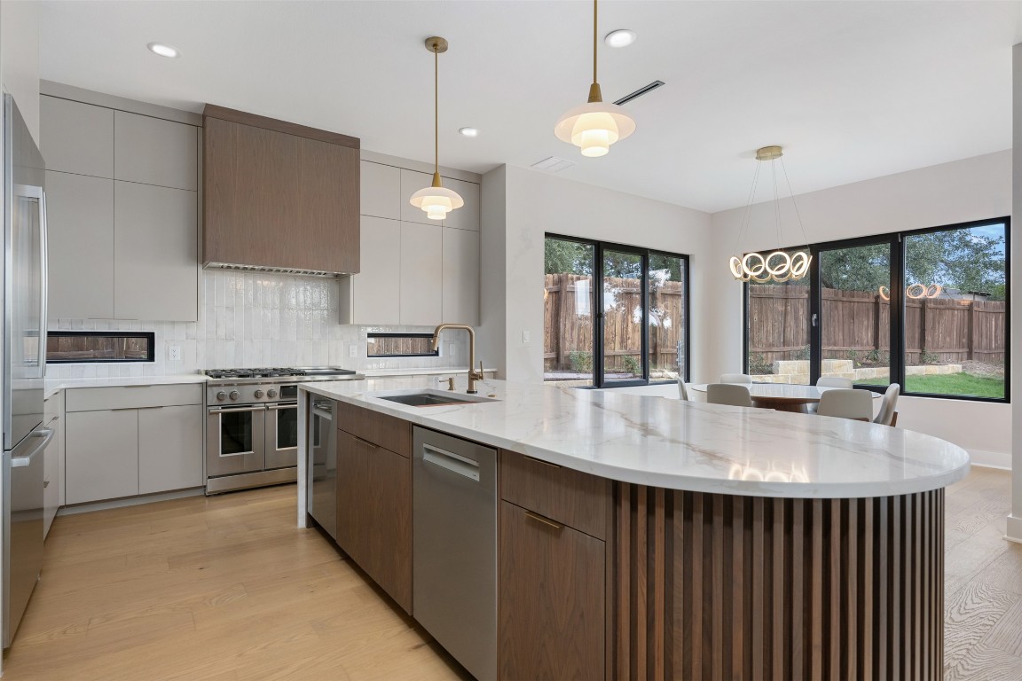 13701 A Montview Drive Austin, TX 78732 - Photo 10 of 40 Gorgeous kitchen open to dining and family room with lots of natural light and views.