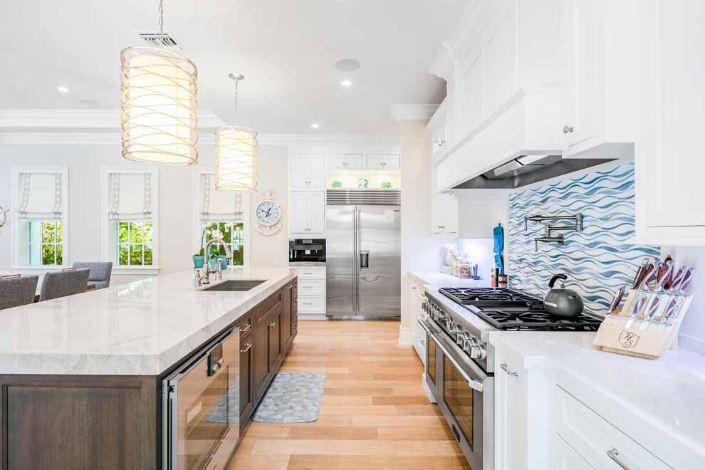 1230 North Ocean Boulevard Gulf Stream, FL 33483 - Photo 12 of 53 a kitchen that has a sink and a stove