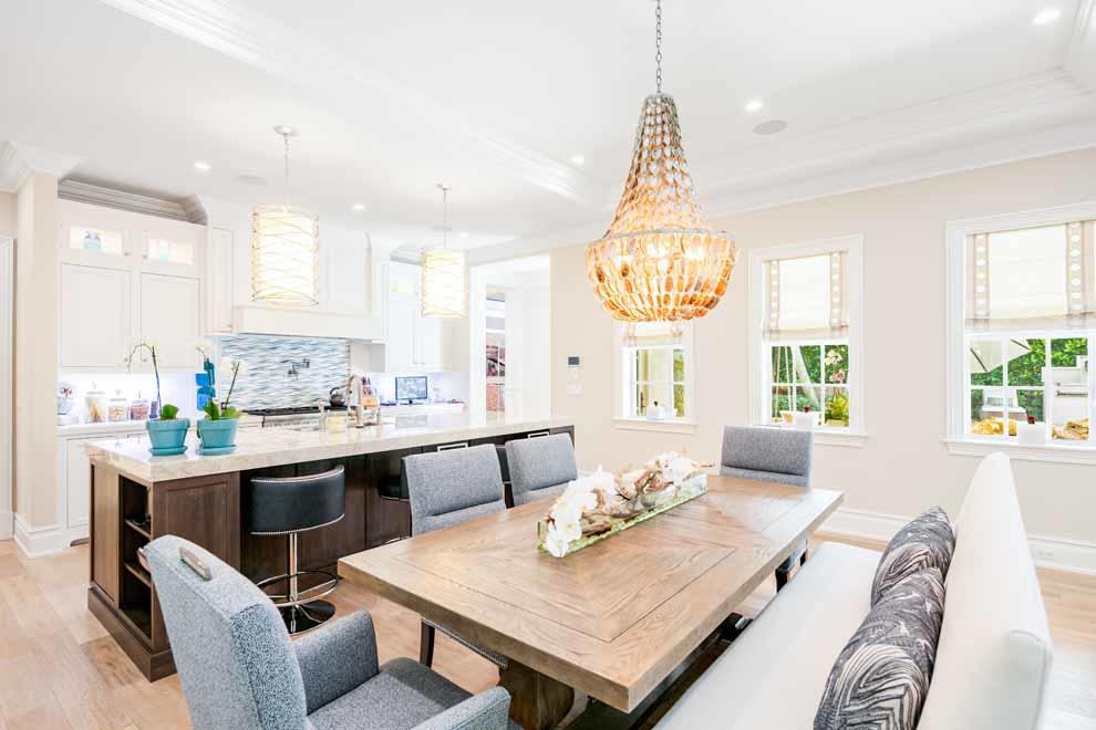 1230 North Ocean Boulevard Gulf Stream, FL 33483 - Photo 15 of 53 a very nice looking dining room with a kitchen island furniture and a chandelier
