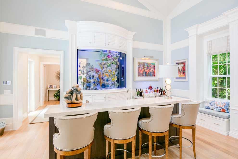 1230 North Ocean Boulevard Gulf Stream, FL 33483 - Photo 16 of 53 a view of a dining room with furniture a kitchen and wooden floor