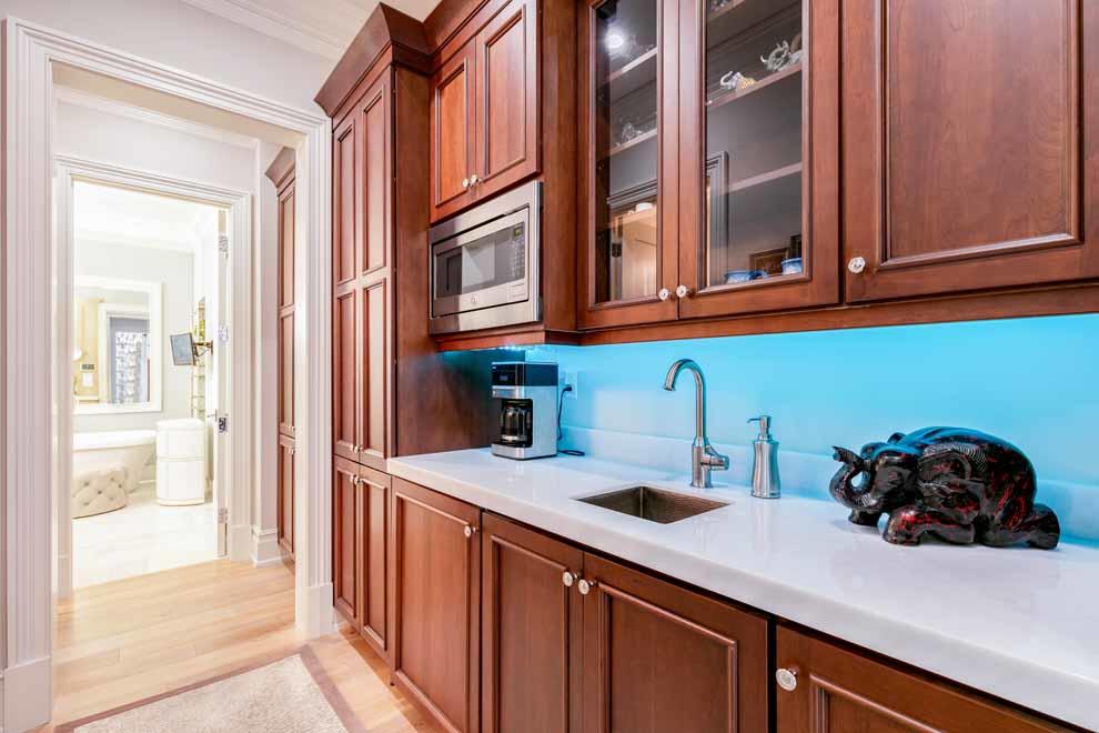 1230 North Ocean Boulevard Gulf Stream, FL 33483 - Photo 20 of 53 a kitchen with a sink and cabinets