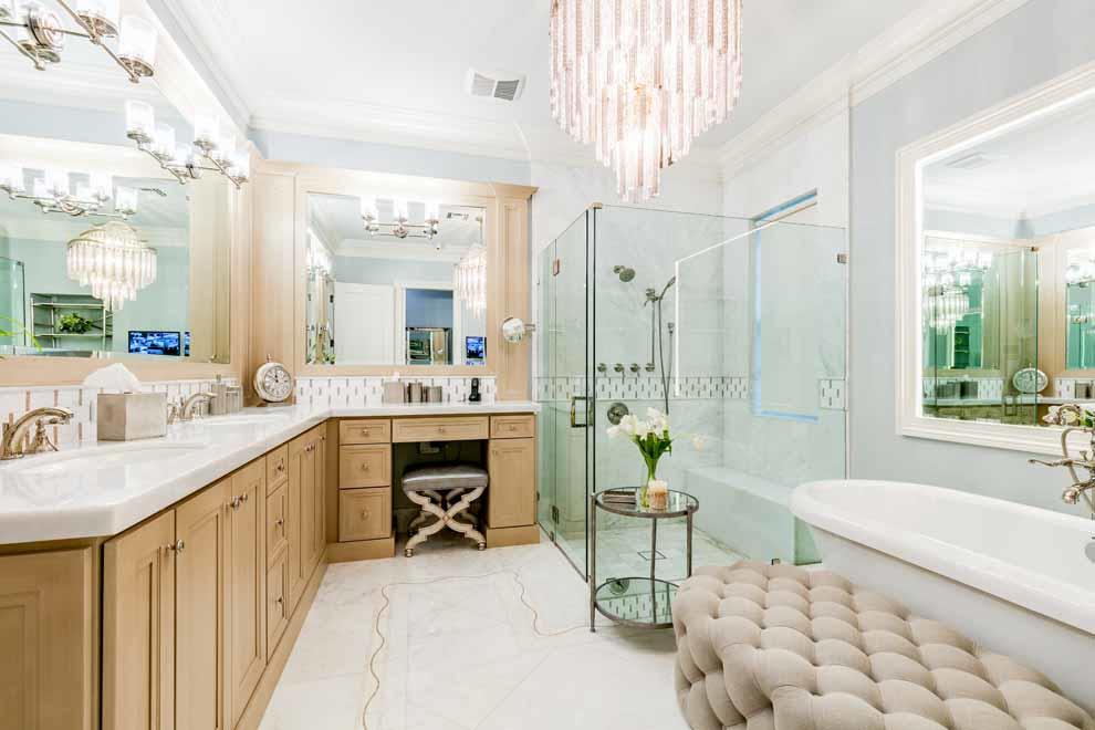 1230 North Ocean Boulevard Gulf Stream, FL 33483 - Photo 23 of 53 a spacious bathroom with a double vanity sink a mirror a bathtub and next to a window