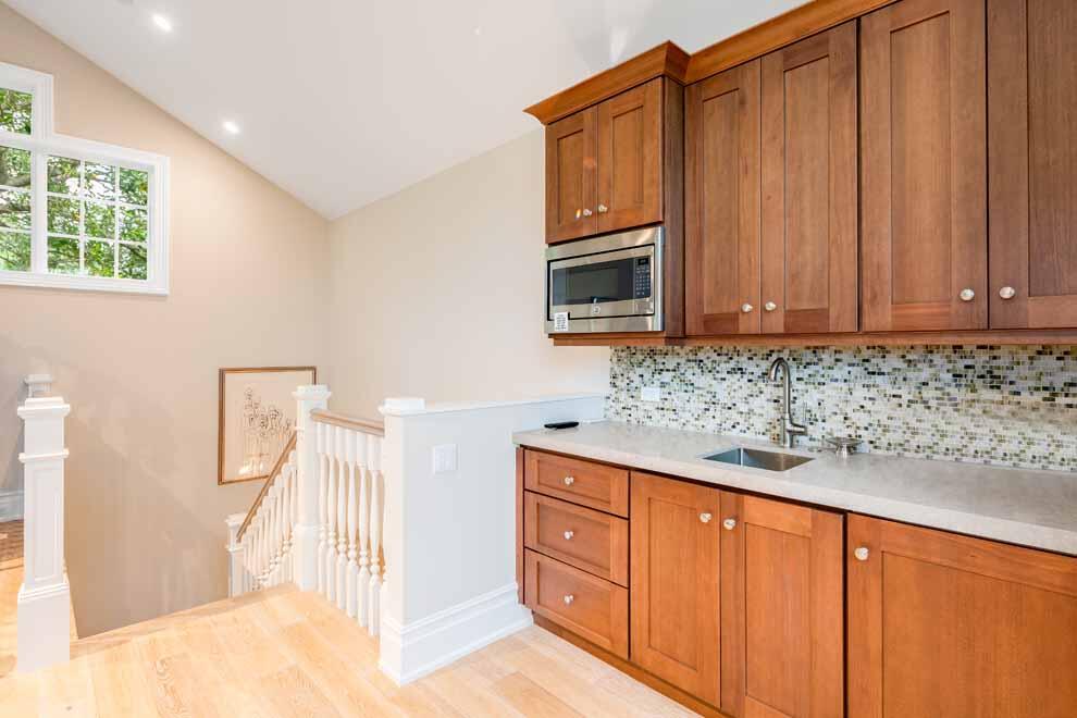 1230 North Ocean Boulevard Gulf Stream, FL 33483 - Photo 28 of 53 a view of a kitchen with wooden cabinets