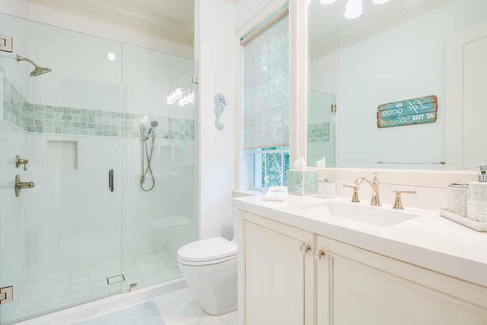 1230 North Ocean Boulevard Gulf Stream, FL 33483 - Photo 35 of 53 a bathroom with a shower sink vanity mirror and toilet