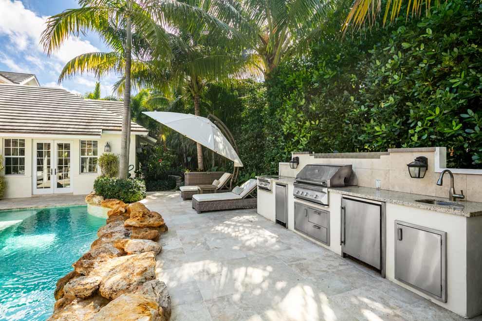 1230 North Ocean Boulevard Gulf Stream, FL 33483 - Photo 40 of 53 a view of a kitchen with a sink and dishwasher with a yard