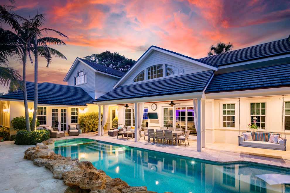 1230 North Ocean Boulevard Gulf Stream, FL 33483 - Photo 48 of 53 a view of a swimming pool with a patio