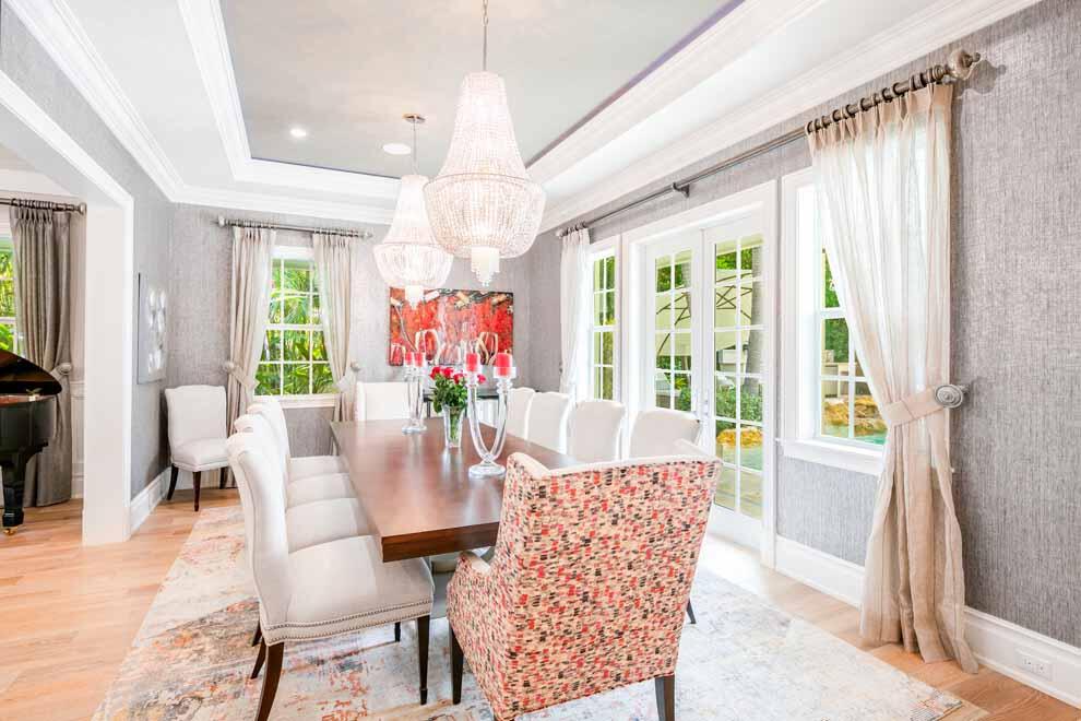 1230 North Ocean Boulevard Gulf Stream, FL 33483 - Photo 10 of 53 a view of a dining room with furniture wooden floor and chandelier