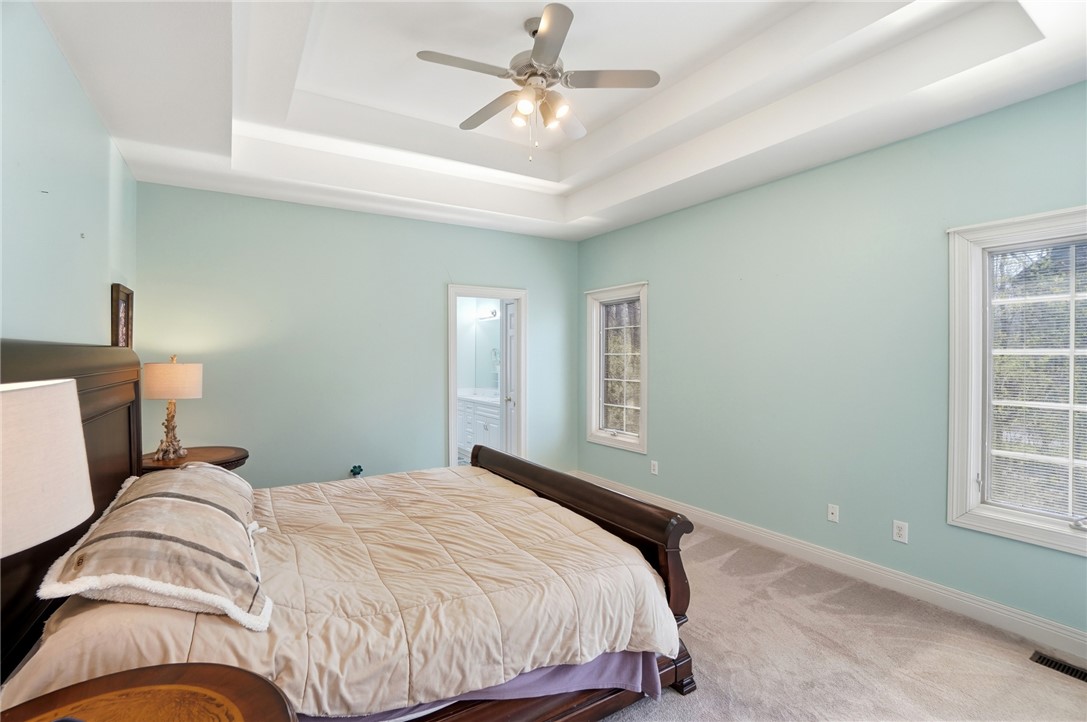 472 Timber Walk Court Springboro, OH 45066 - Photo 19 of 86 This tranquil primary bedroom offers comfort and style, creating a peaceful retreat.