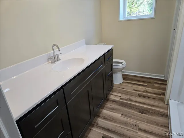 a view of wooden floor in a bathroom
