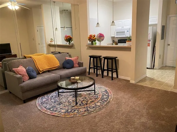 a living room with furniture and a table