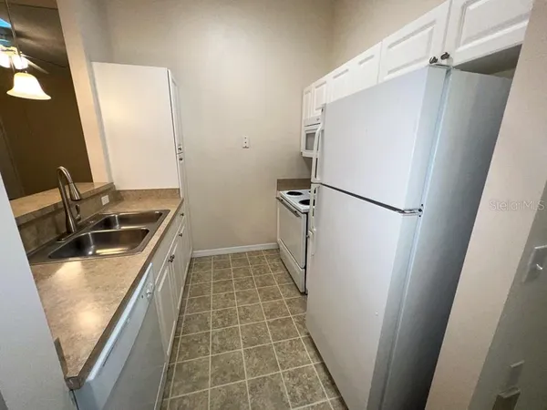 a view of a kitchen from a window