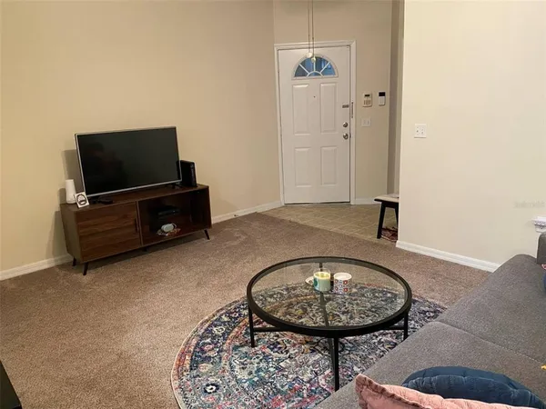 a view of a livingroom with furniture