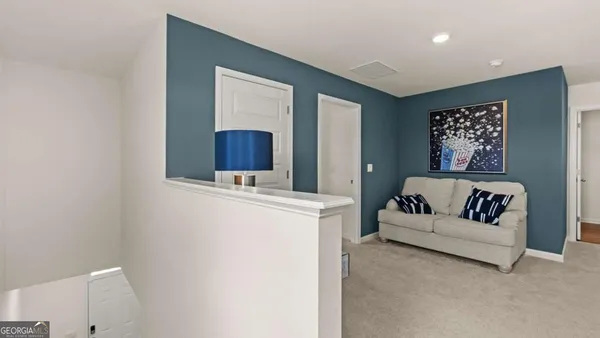 a living room with furniture and a table