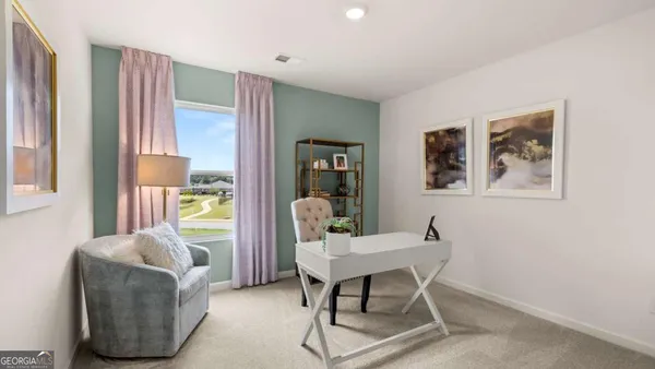 a workspace with furniture and a window