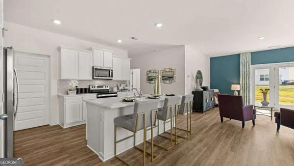 a view of kitchen with cabinets and wooden floor