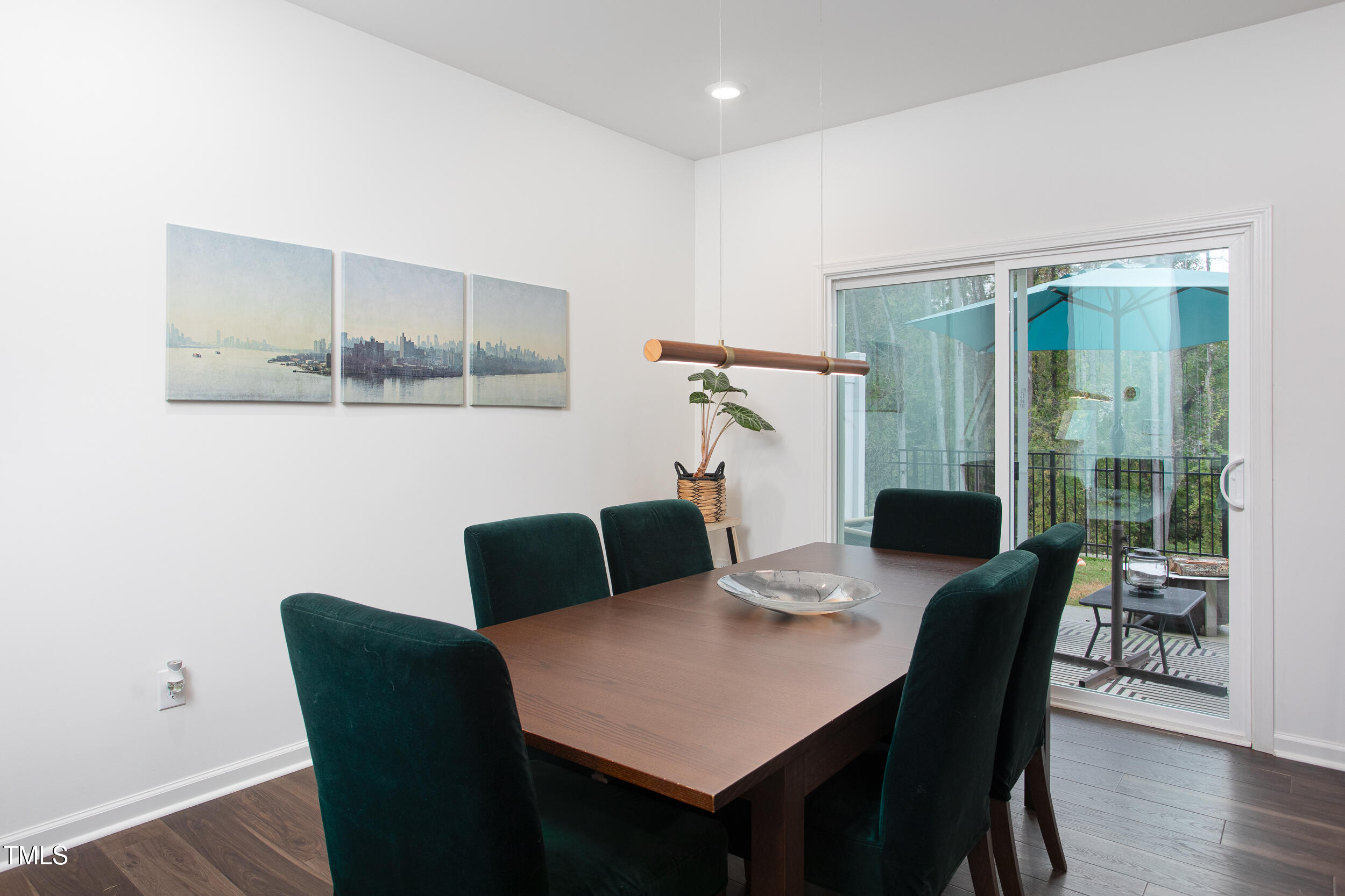 128 Rialto Street Chapel Hill, NC 27516 - Photo 12 of 44 a view of a dining room with furniture and wooden floor