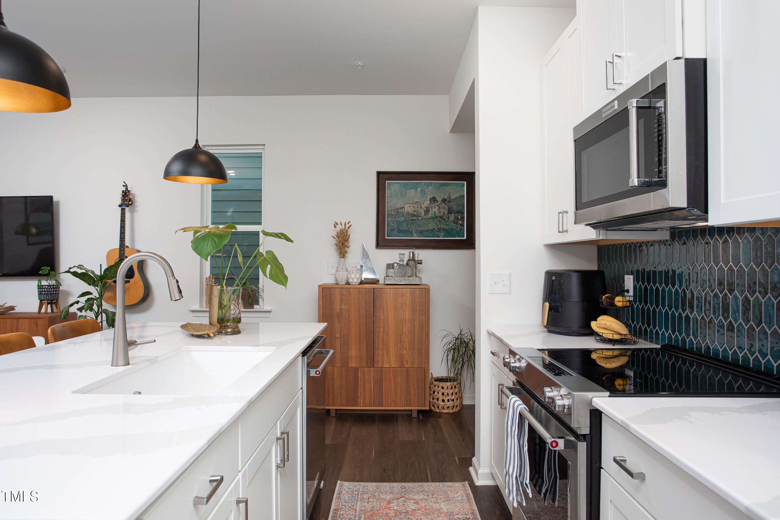 128 Rialto Street Chapel Hill, NC 27516 - Photo 17 of 44 a kitchen with a sink stove and microwave