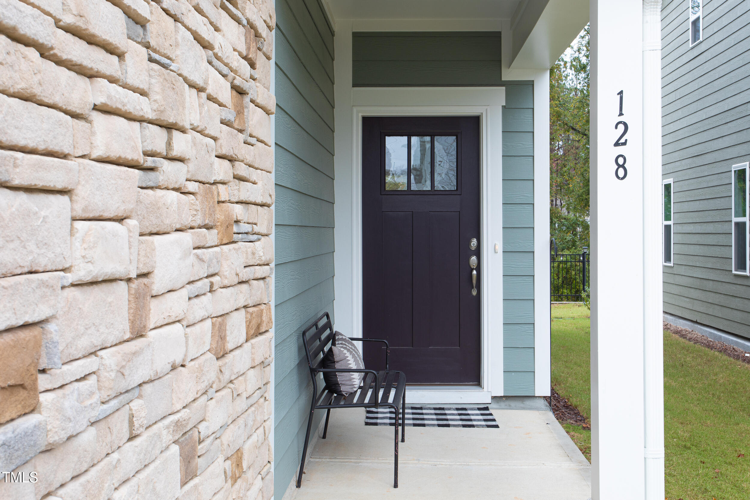 128 Rialto Street Chapel Hill, NC 27516 - Photo 2 of 44 a front view of a house with a glass door