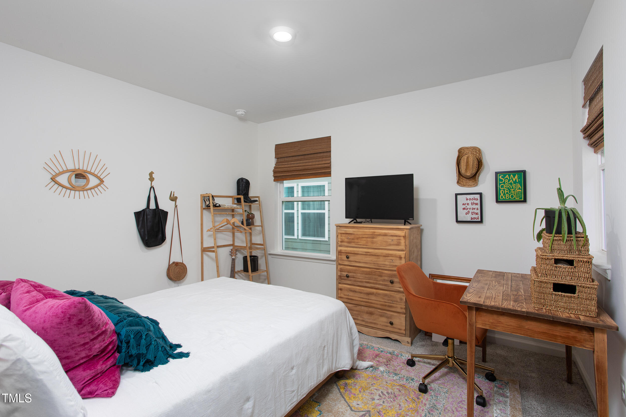 128 Rialto Street Chapel Hill, NC 27516 - Photo 32 of 44 a bedroom with a bed and a flat screen tv