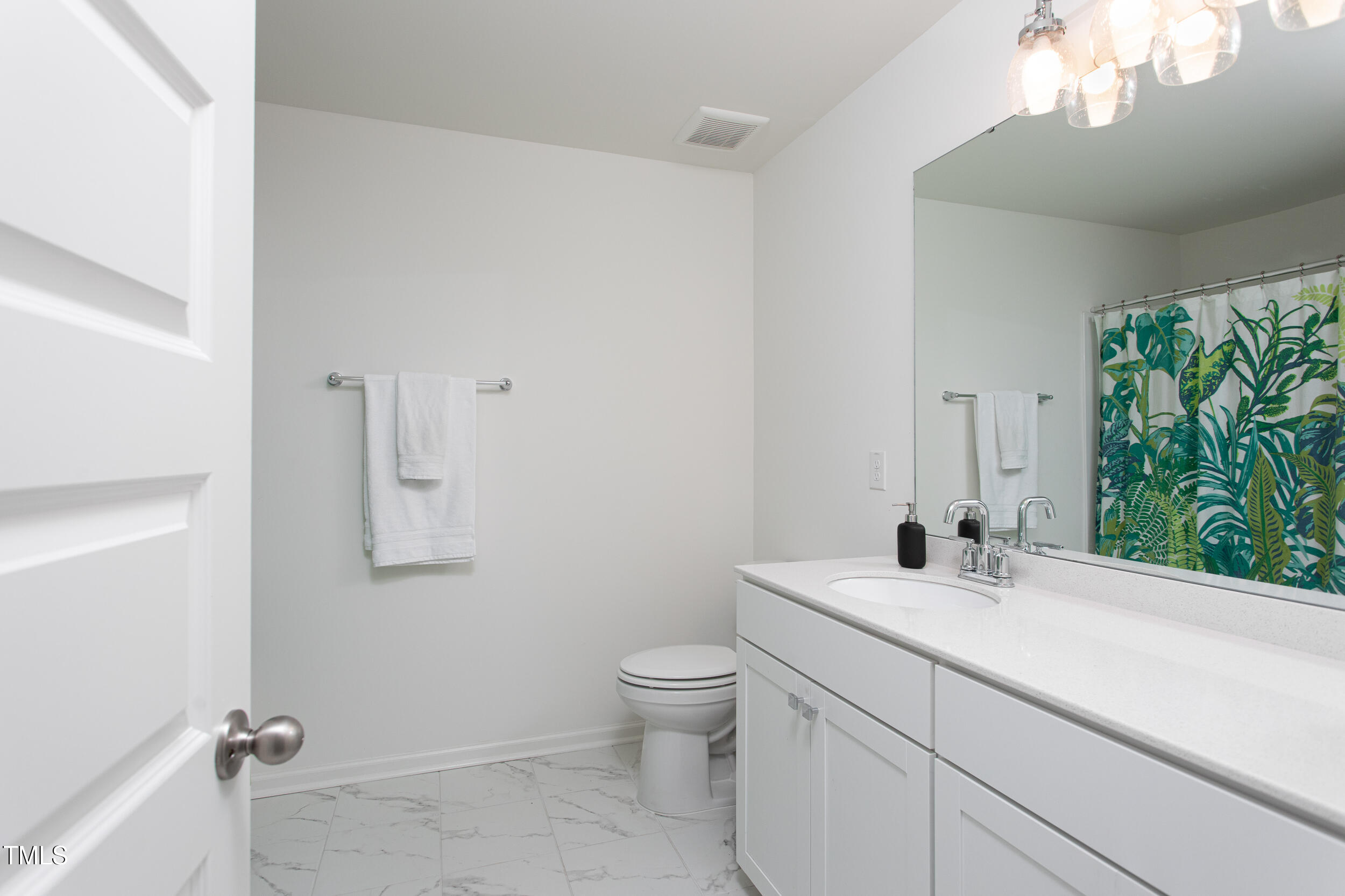 128 Rialto Street Chapel Hill, NC 27516 - Photo 36 of 44 a bathroom with a sink a toilet and a mirror