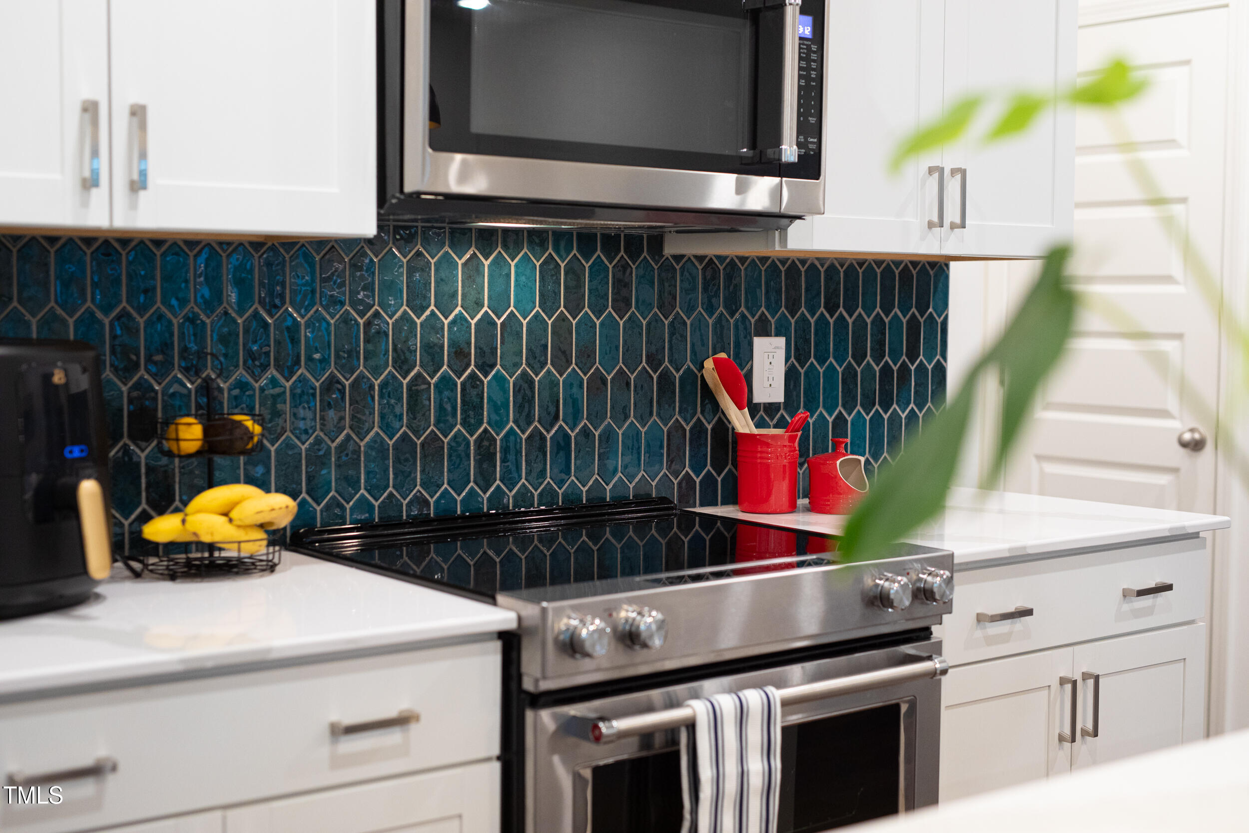 128 Rialto Street Chapel Hill, NC 27516 - Photo 8 of 44 a kitchen sink with stove and cabinets