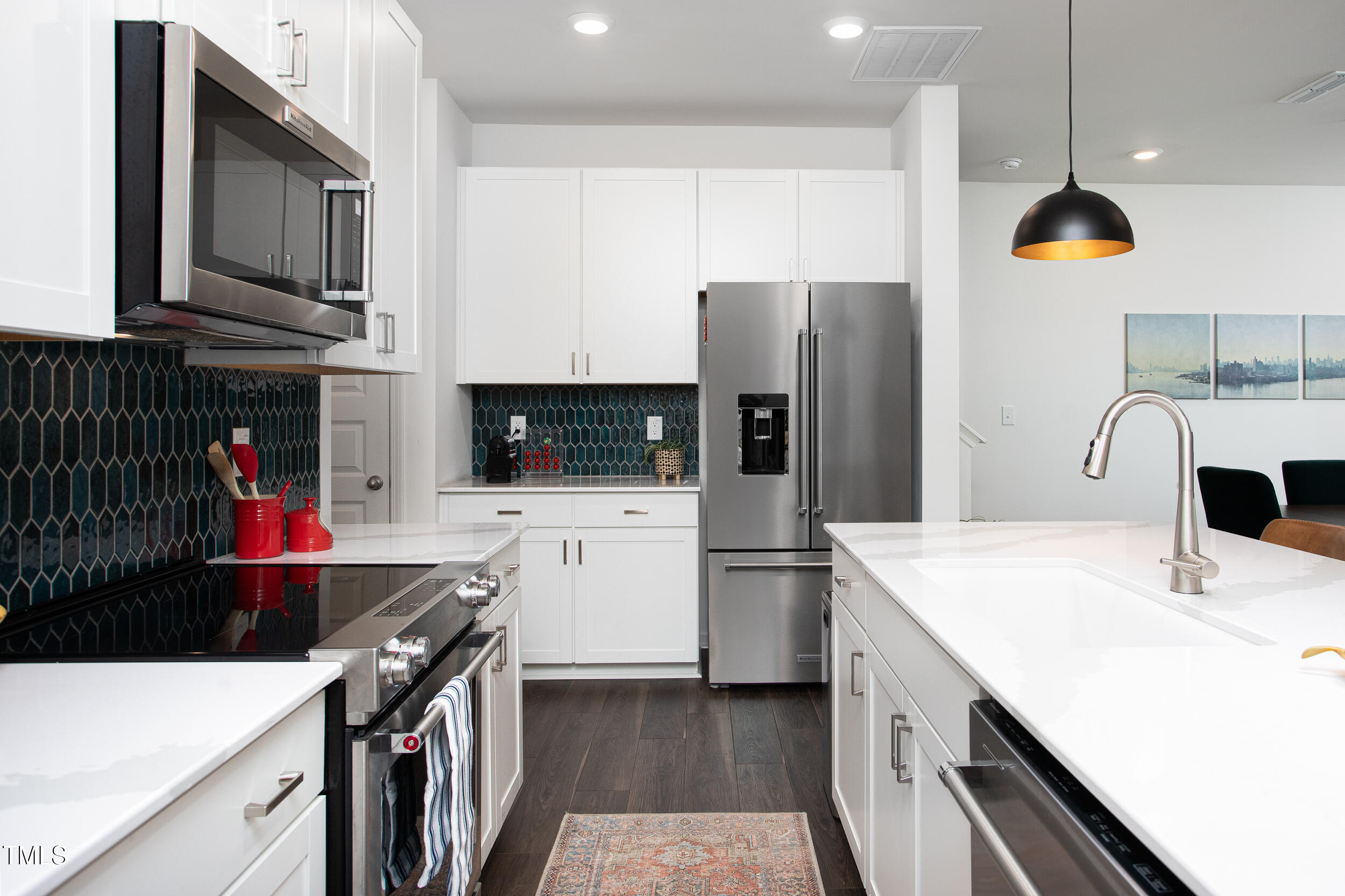 128 Rialto Street Chapel Hill, NC 27516 - Photo 10 of 44 a kitchen with stainless steel appliances a stove microwave and a refrigerator