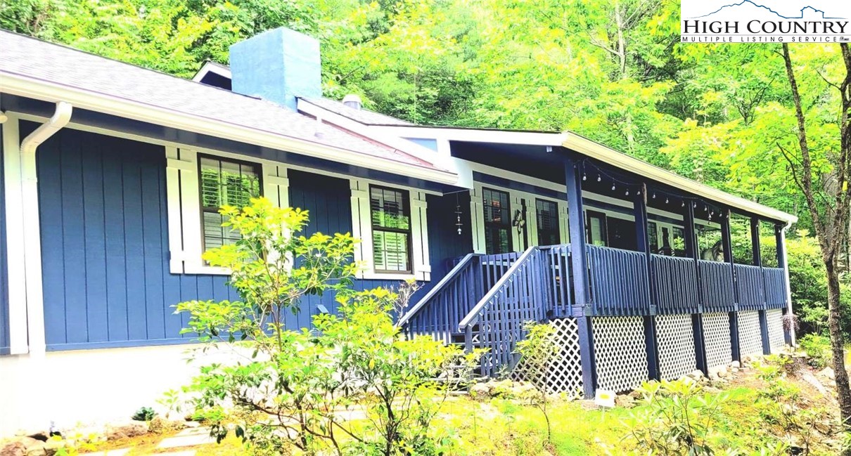 1157 Pine Ridge Road Beech Mountain, NC 28604 - Photo 1 of 25 a front view of a house with a yard