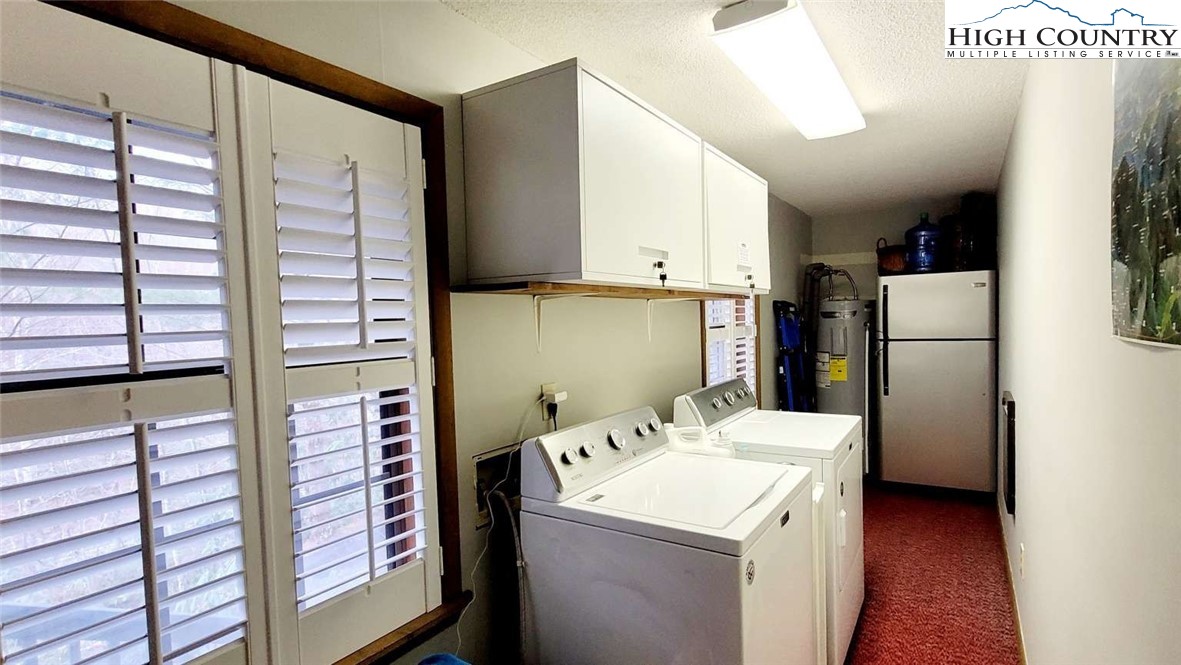 1157 Pine Ridge Road Beech Mountain, NC 28604 - Photo 16 of 25 a utility room with dryer and washer